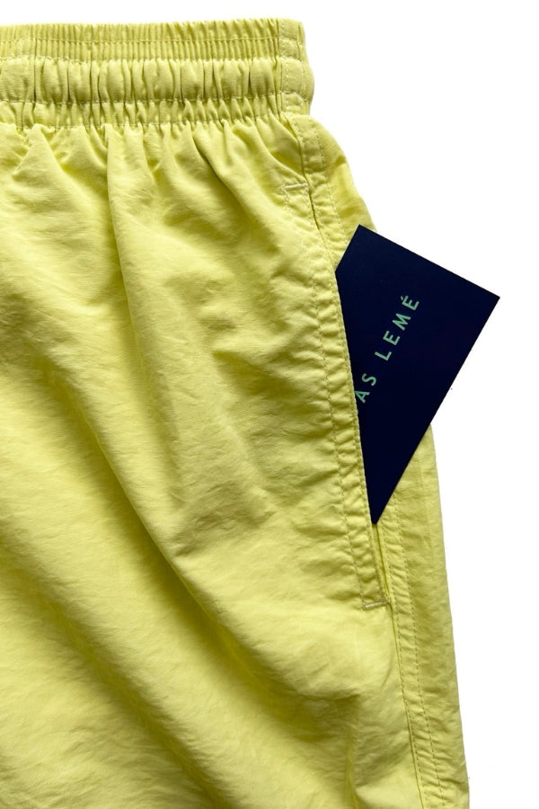 FRONT POCKET OF THE SWIM TRUNKS