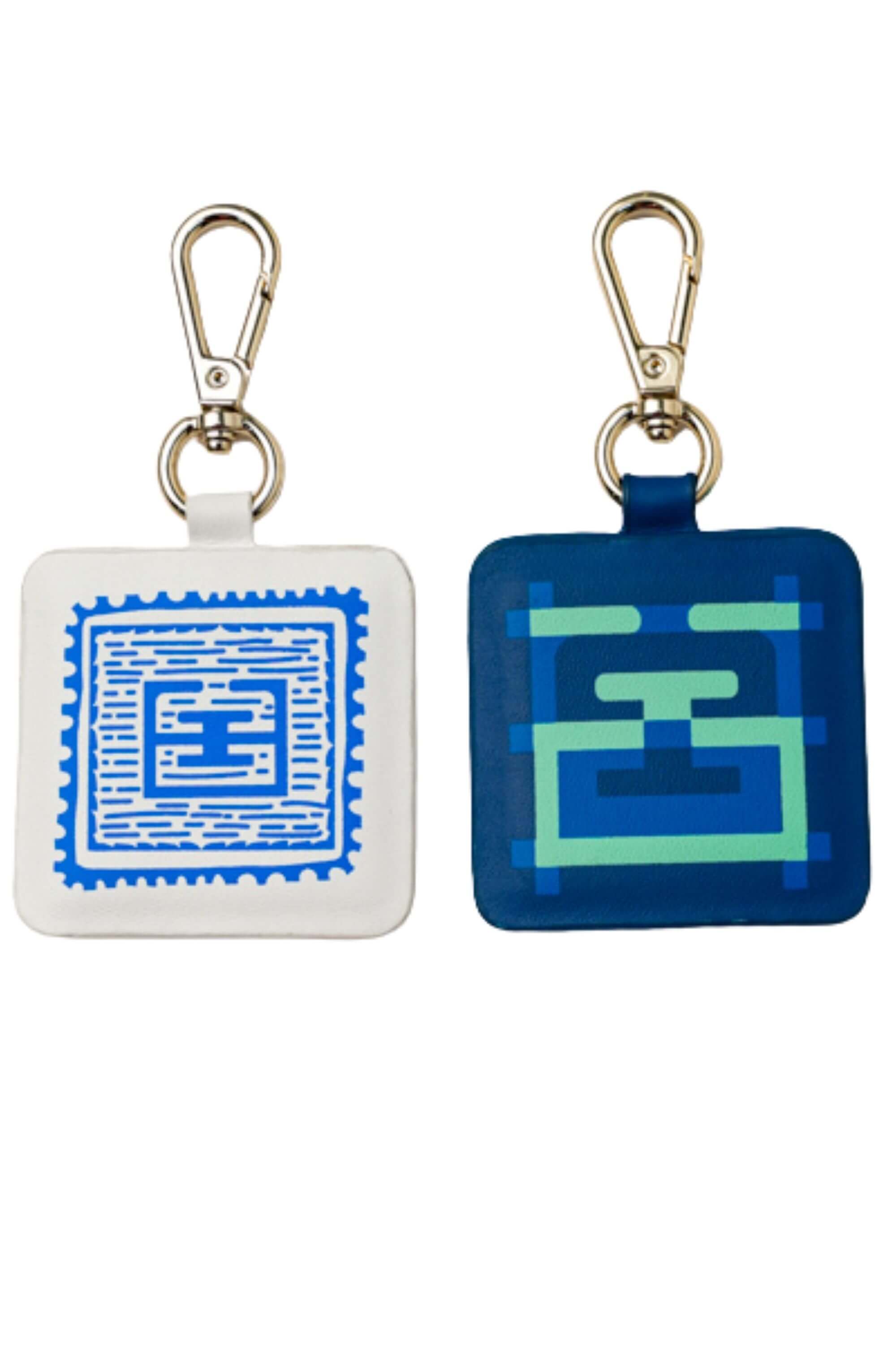 Two blue stamp edition bag charms - Front view