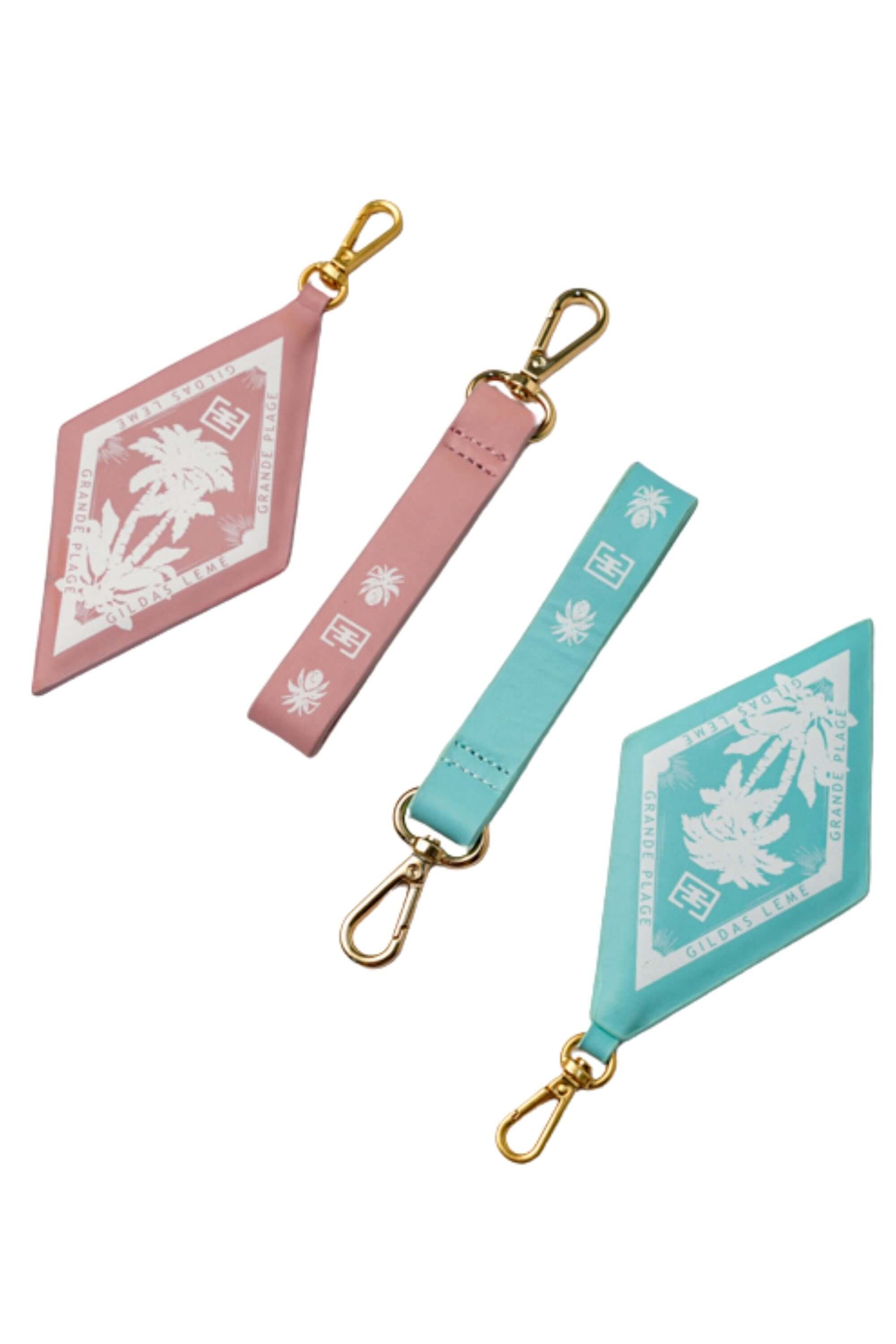 Two paradise edition bag charms and keychain pink and blue