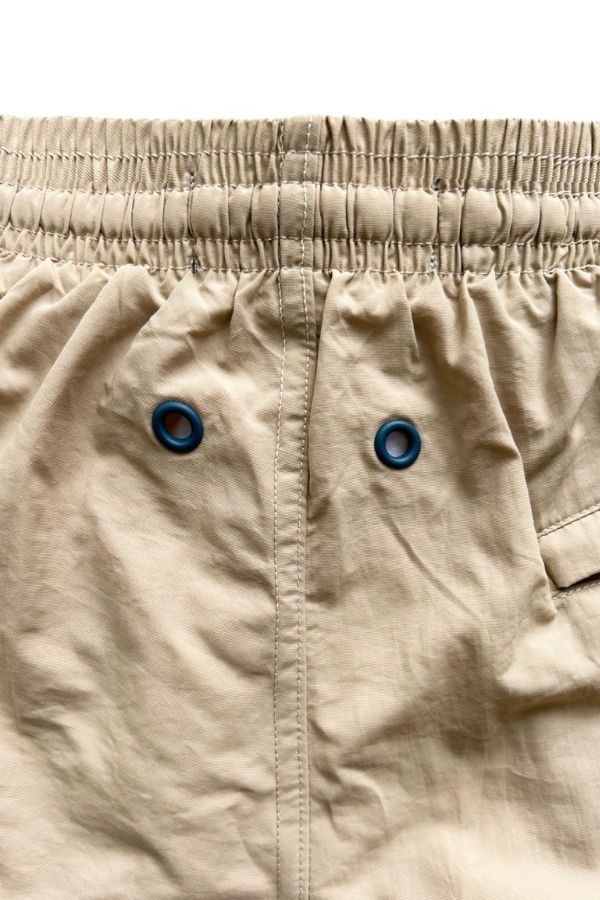 WAISTBAND OF THE BEIGE RHUYS SWIM TRUNKS