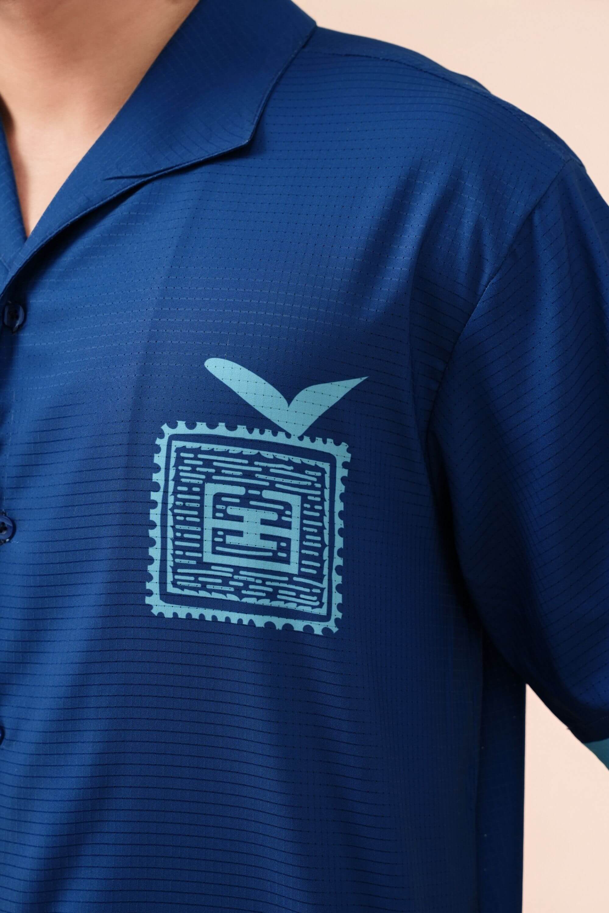 blue stamp resort shirt navy logo view on model #color_navy
