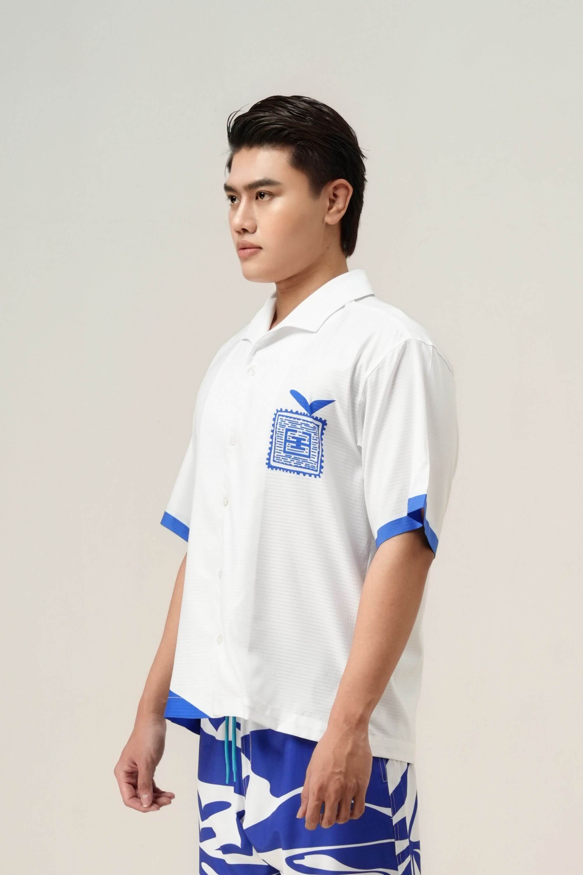 blue stamp resort shirt on model view #color_white