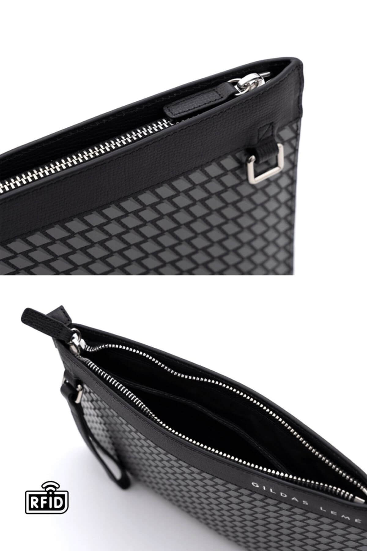 Close-up details of black clutch bag showing texture and stitching