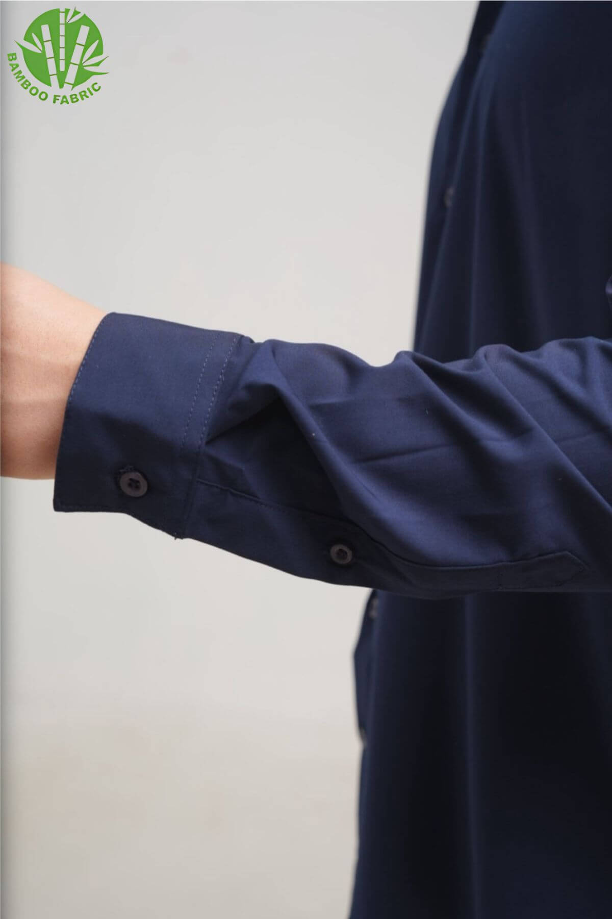 Close-up of the cuff on men’s navy bamboo Riviera long sleeve shirt – refined stitching and eco-friendly fabric finish