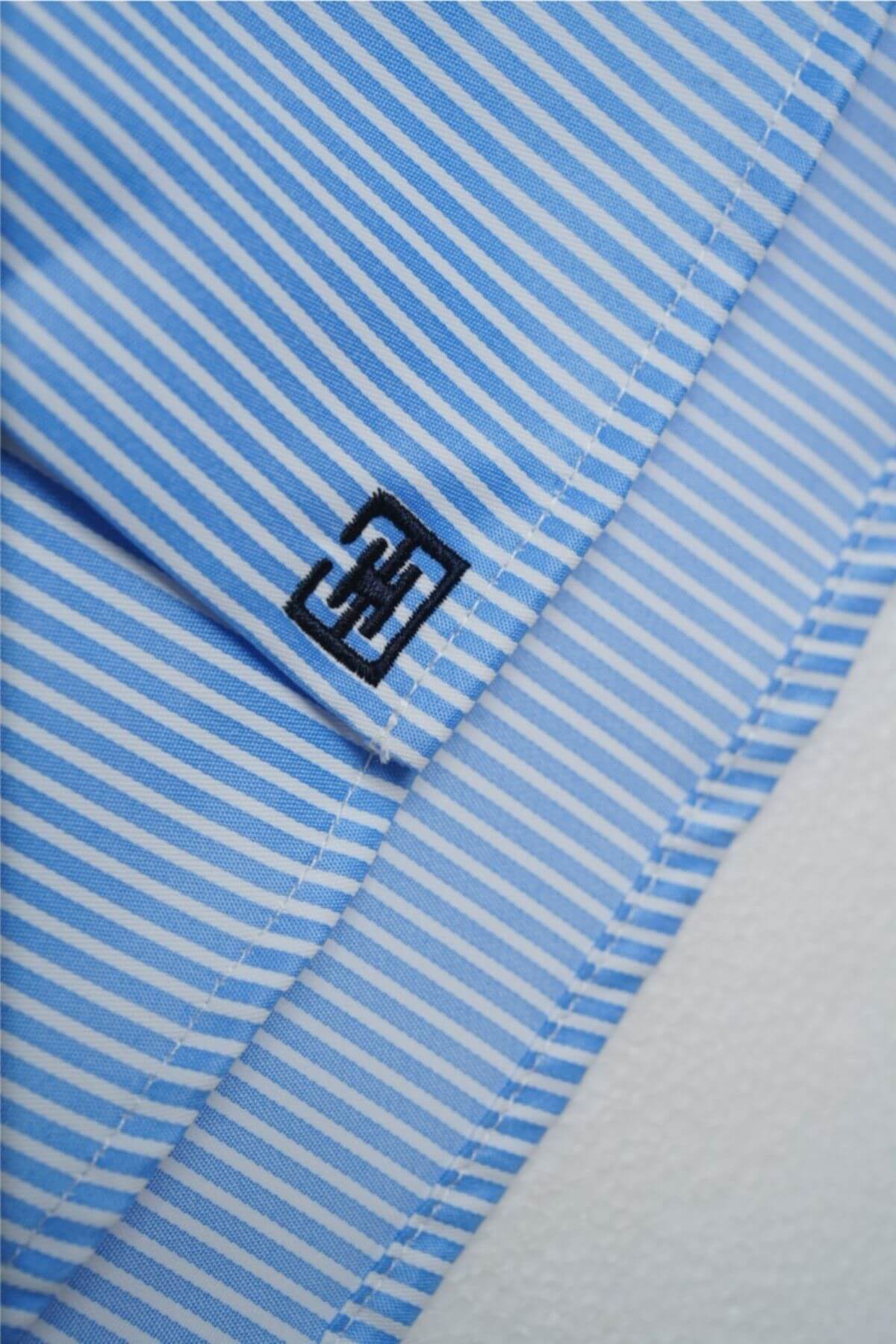 Logo detail at hem of Riviera men’s long-sleeve striped shirt