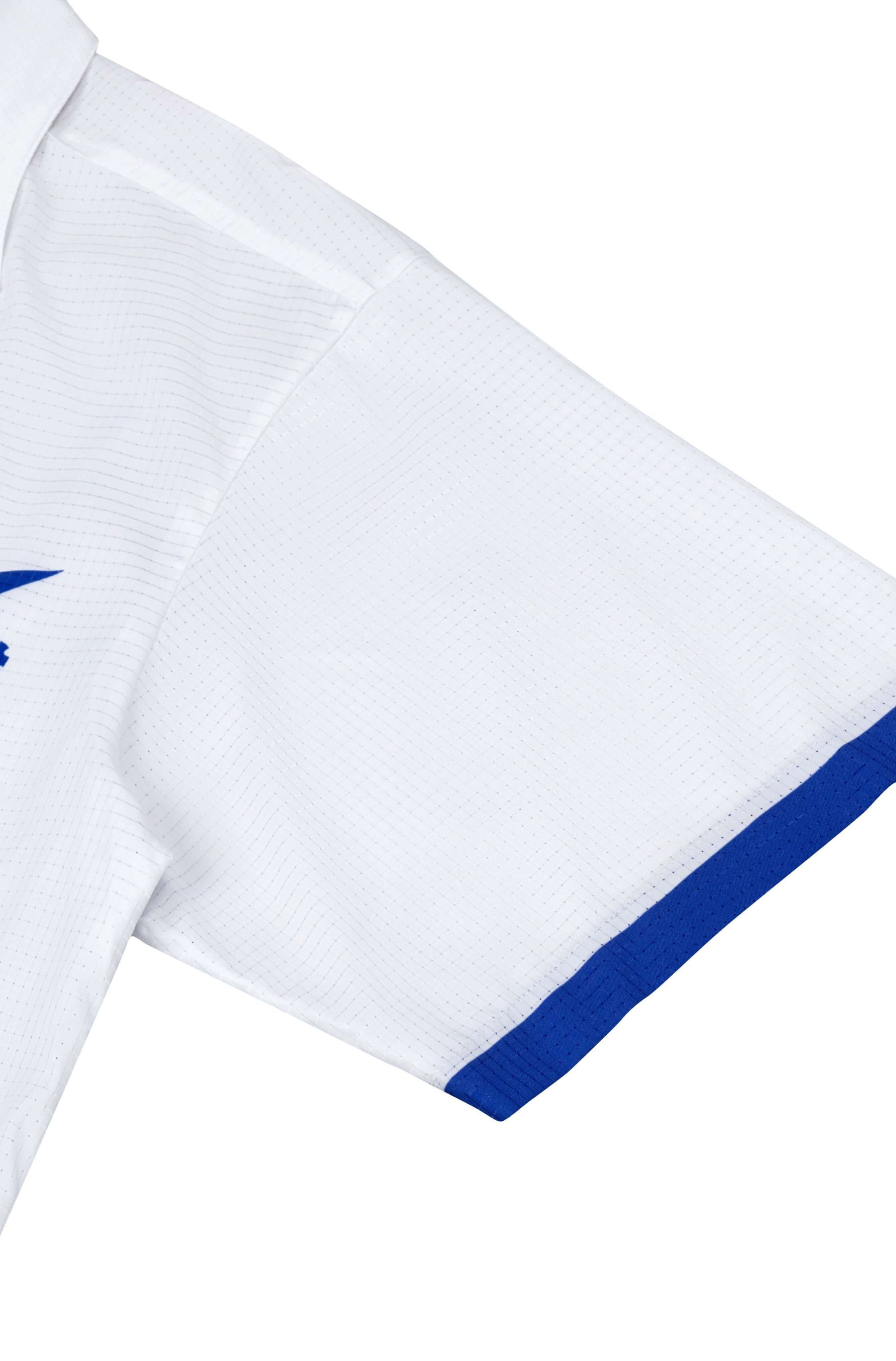 Sleeve detail of men’s white Blue Stamp beach shirt
