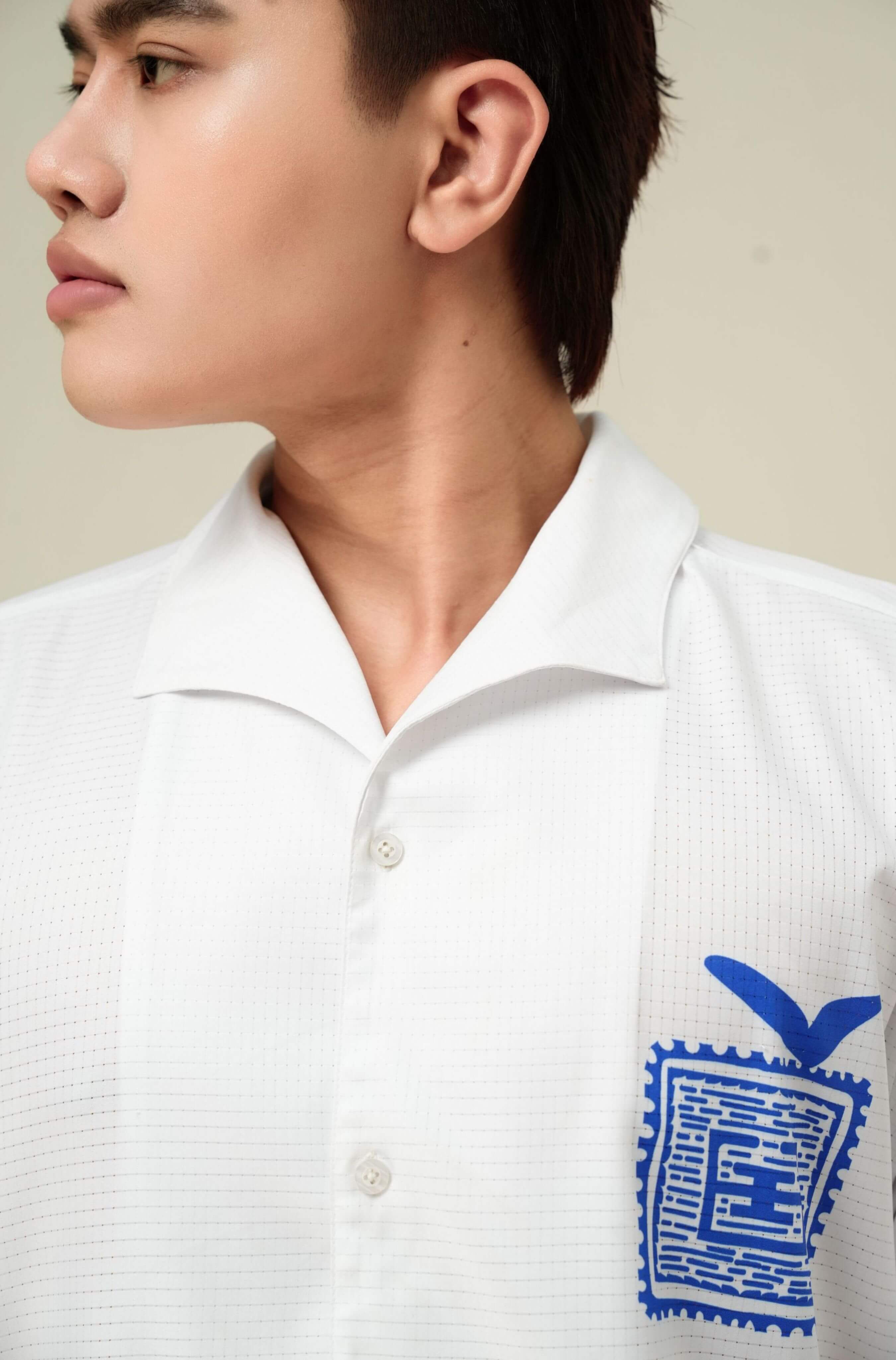 Real-life collar detail of men’s white Blue Stamp resort shirt