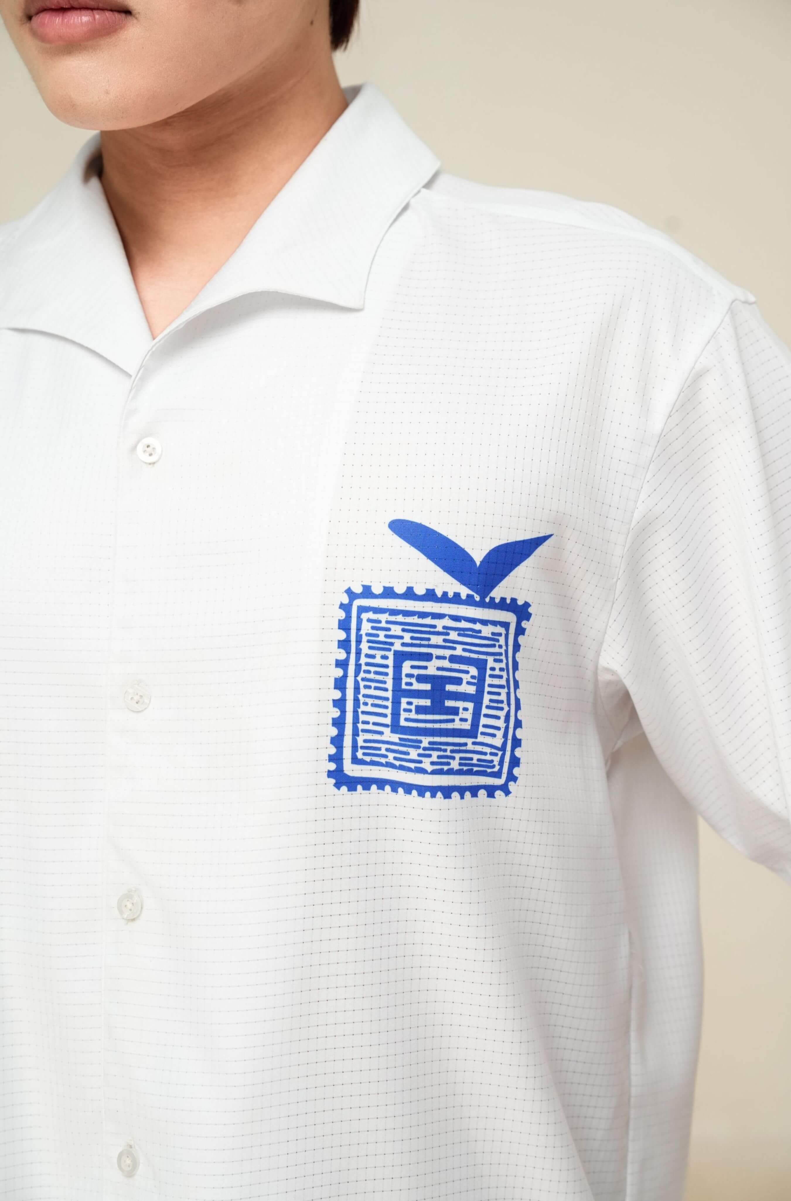 Printed left chest logo on men’s white Blue Stamp resort shirt