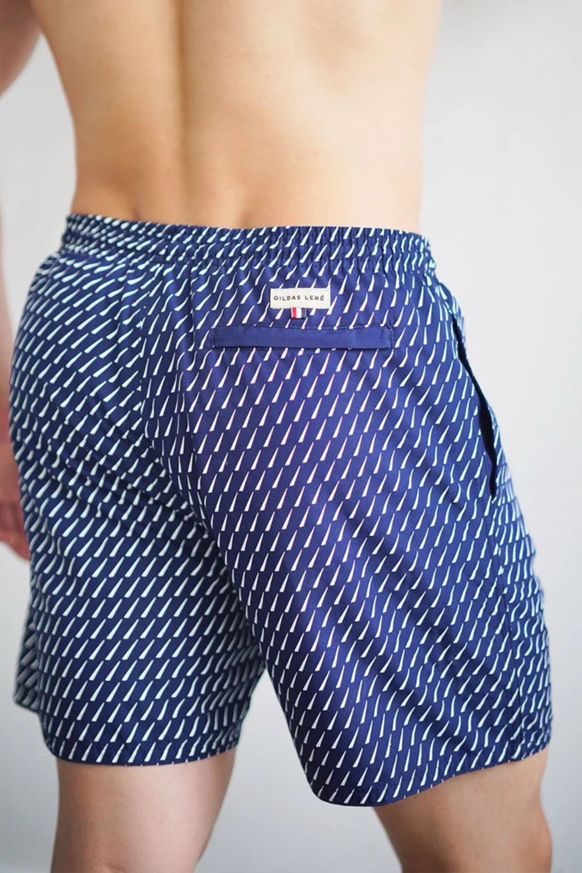 accent swim short model wearing the back view #color_navy