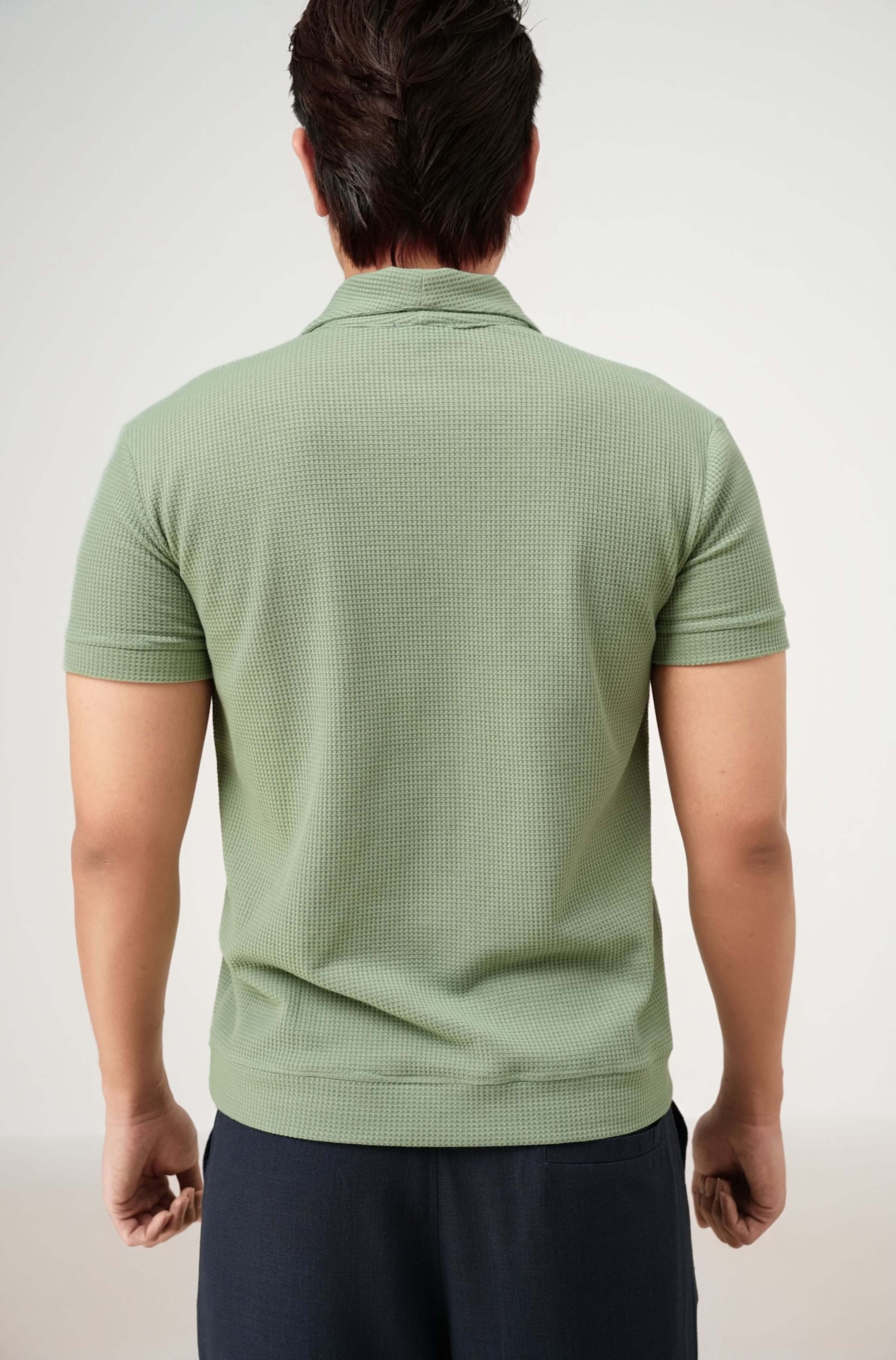 Real-life back label of Palma men’s polo shirt in mint green