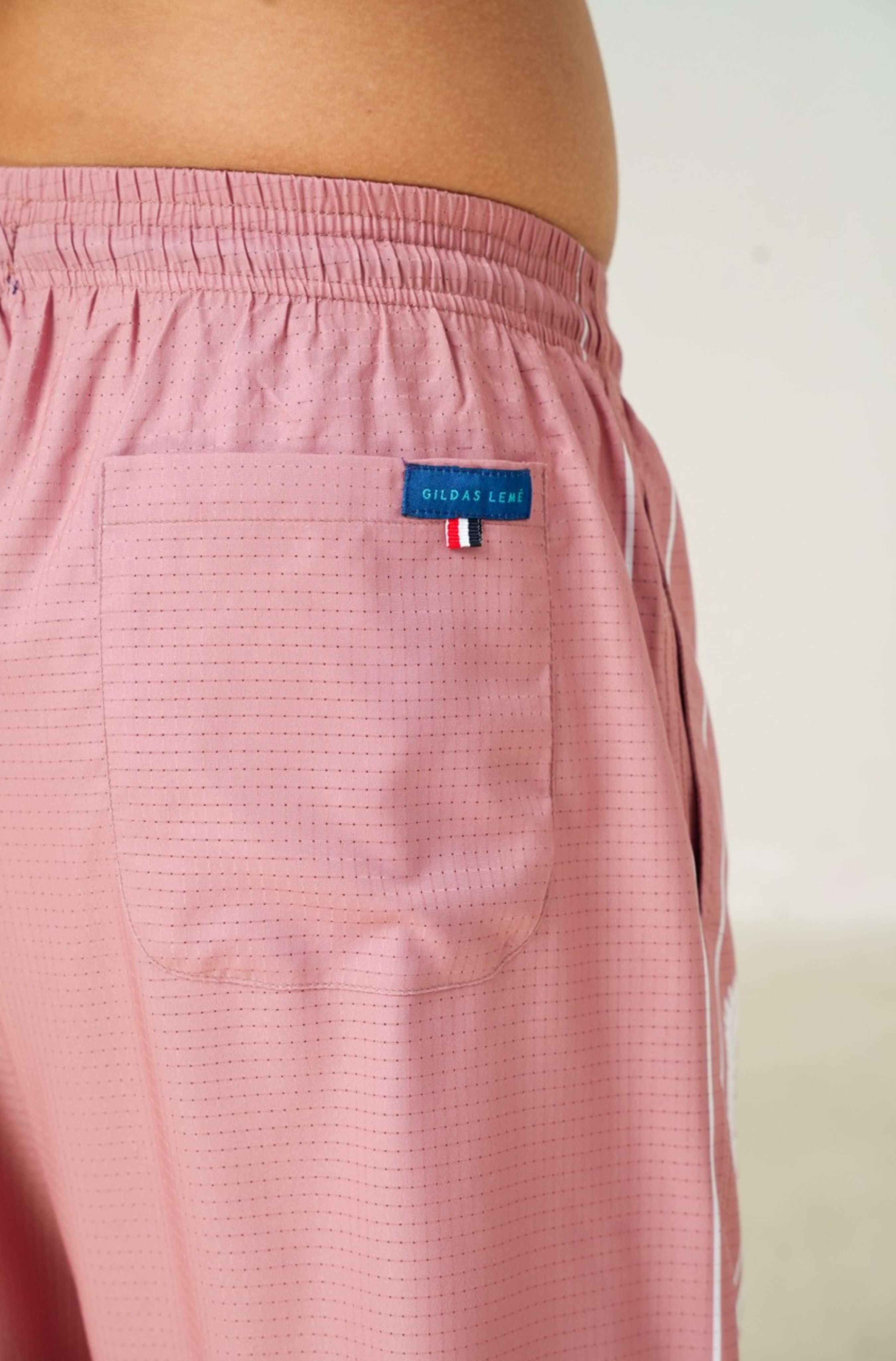 Real-life back pocket photo of Pink Paradise men’s summer resort short