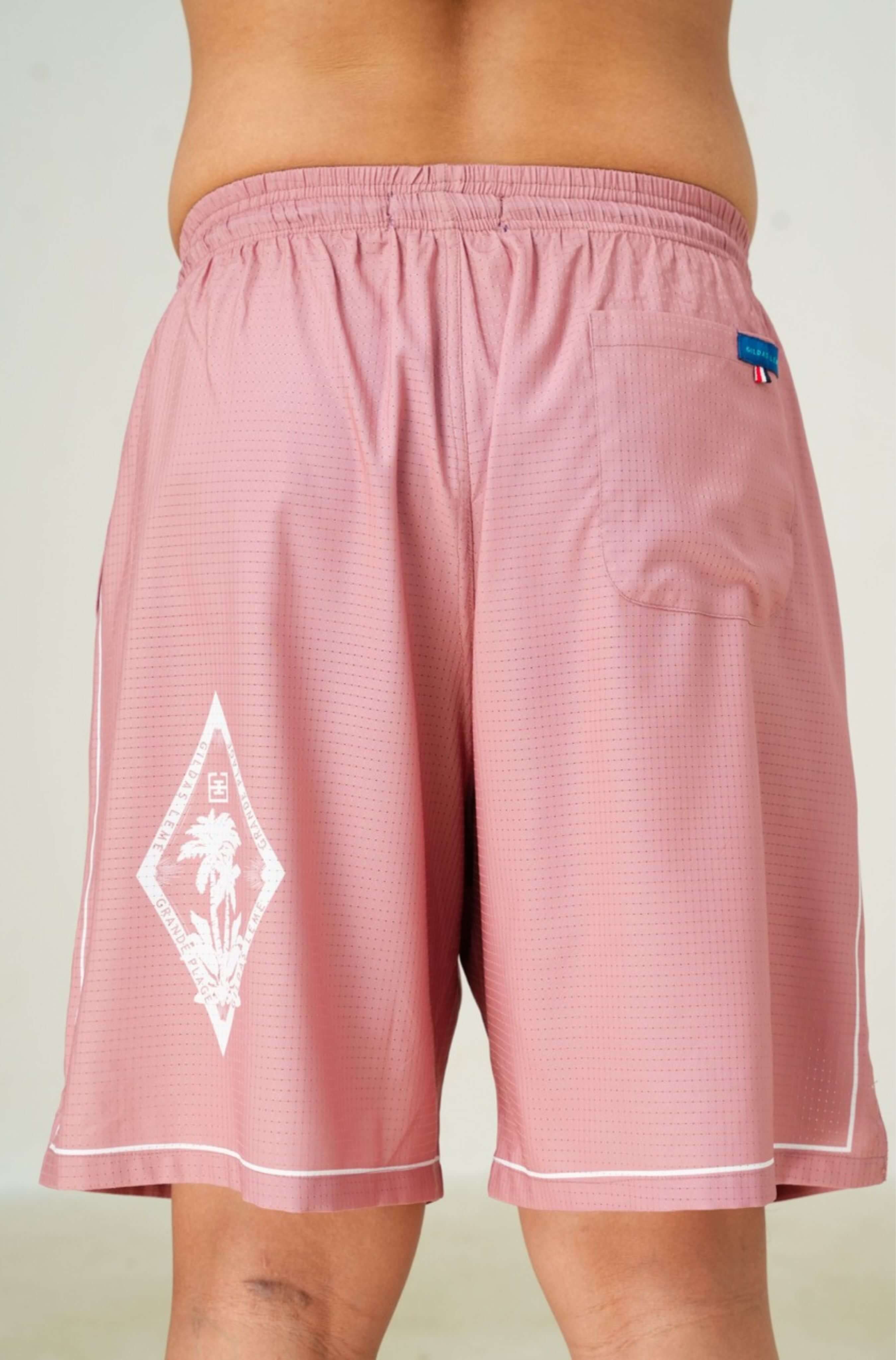 Tag and label color of Pink Paradise men’s summer resort shorts