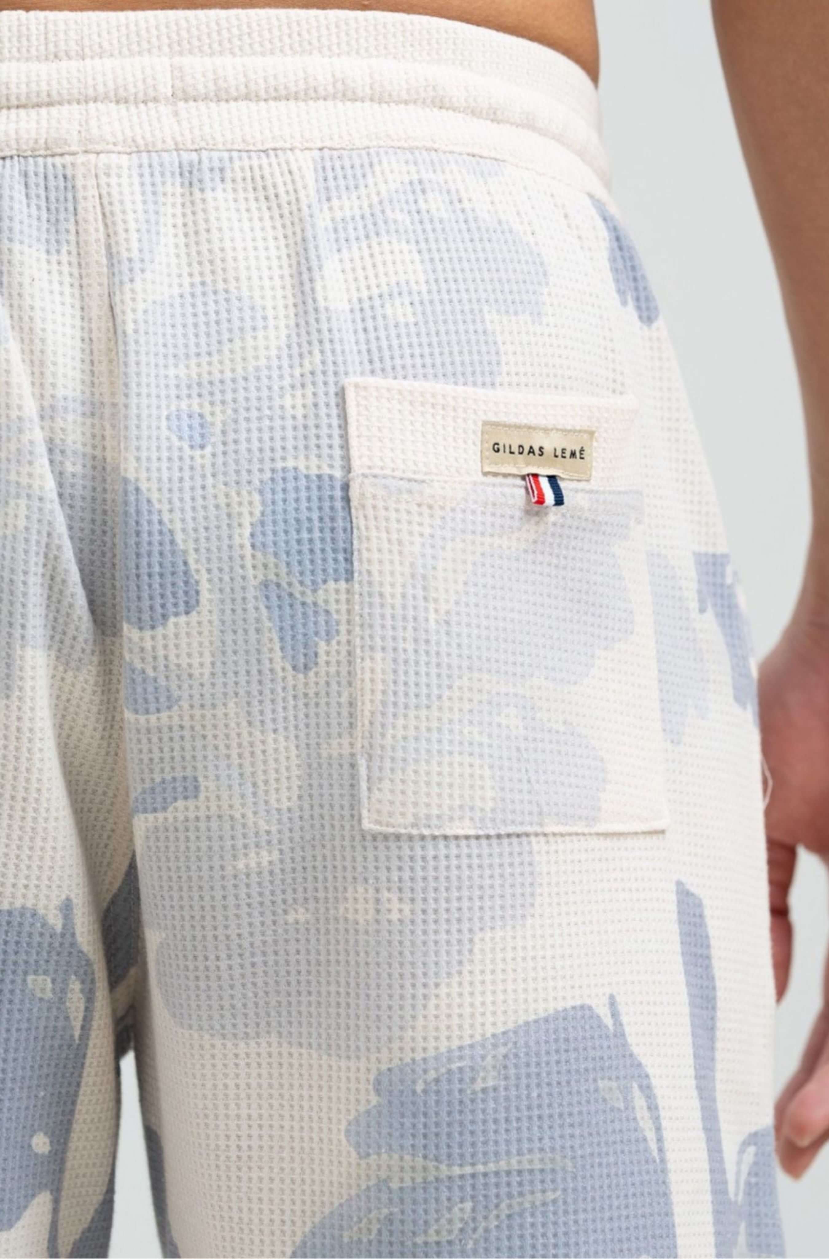 Back pocket detail of Pink Parasol men’s resort short
