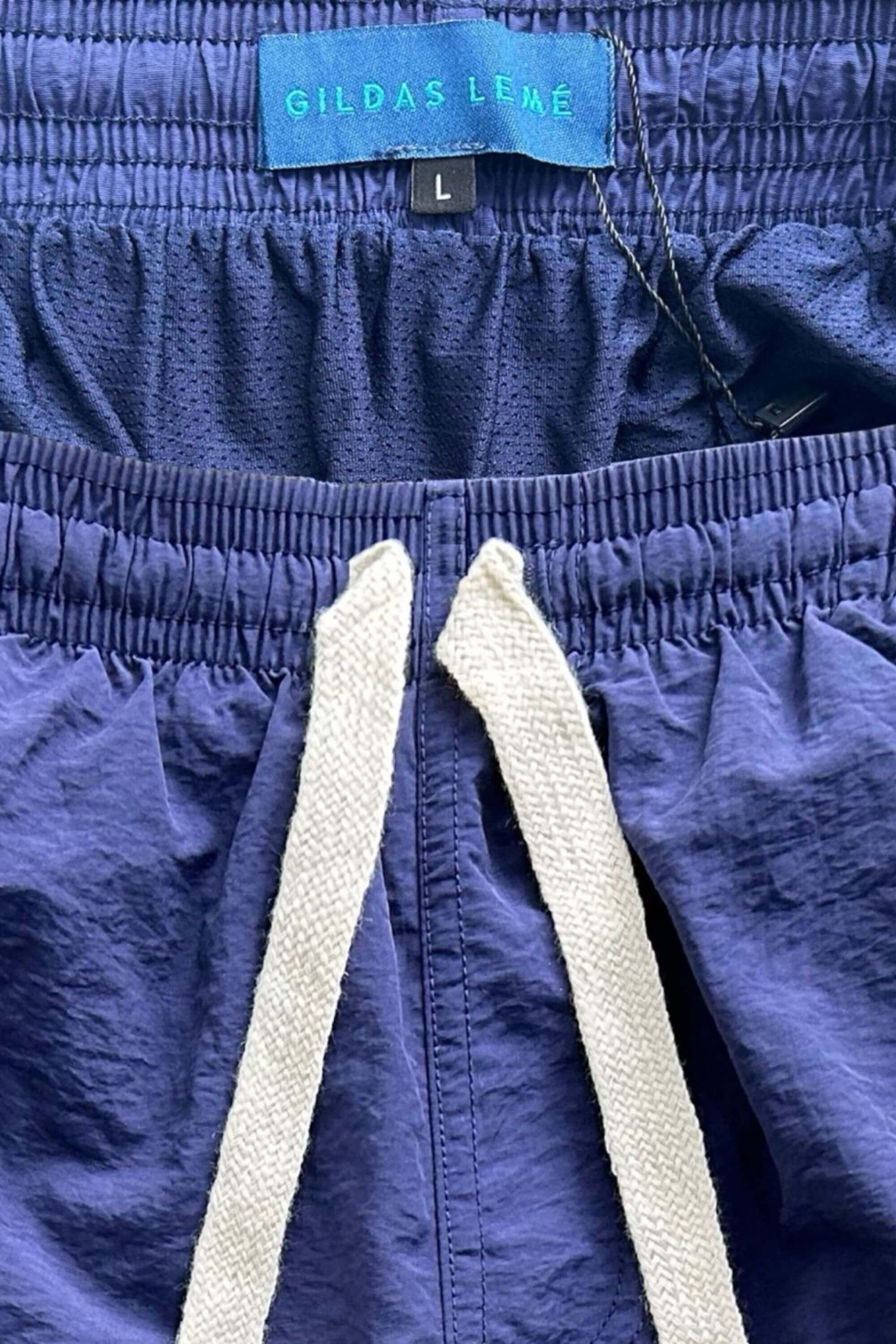 rhuys swim short navy tag logo view #color_navy