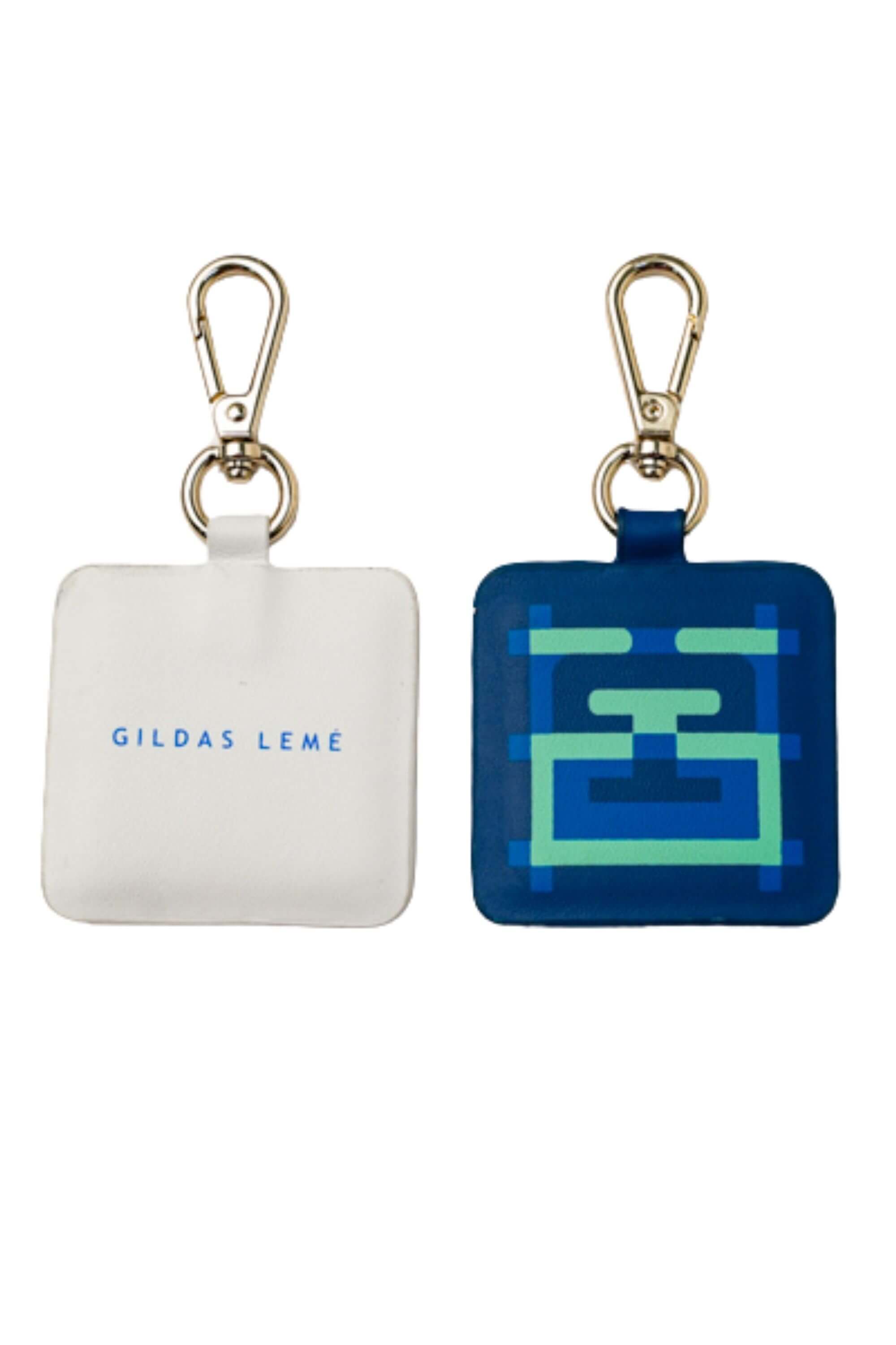 Two blue stamp edition bag charms text and picture