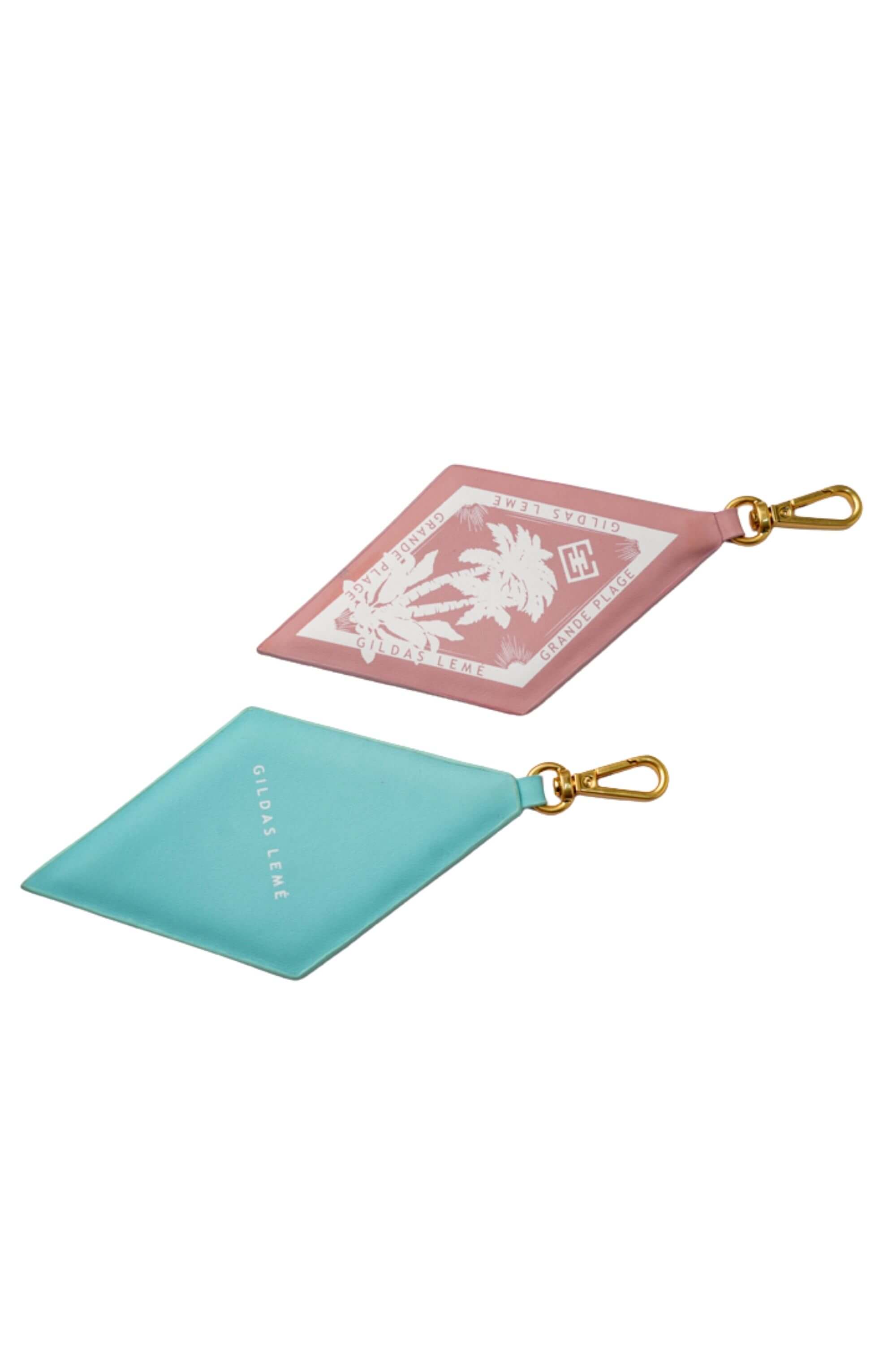 Two paradise edition bag charms and logo - side View