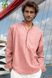 Close-up of the front label on men’s linen shirt with mandarin collar and long sleeves – subtle branding and fine stitching