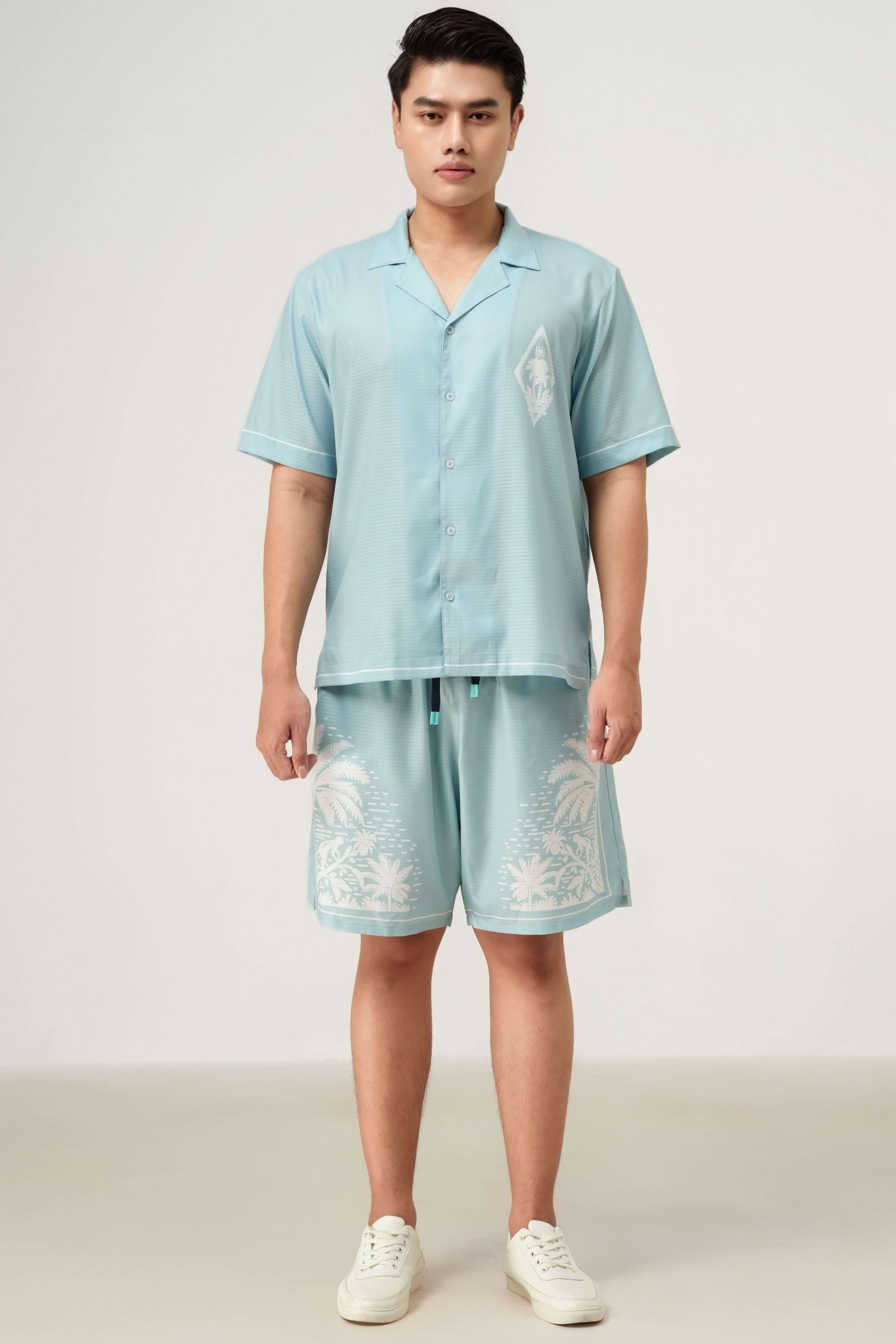 Front label detail of Pink Paradise men’s resortwear set in light blue