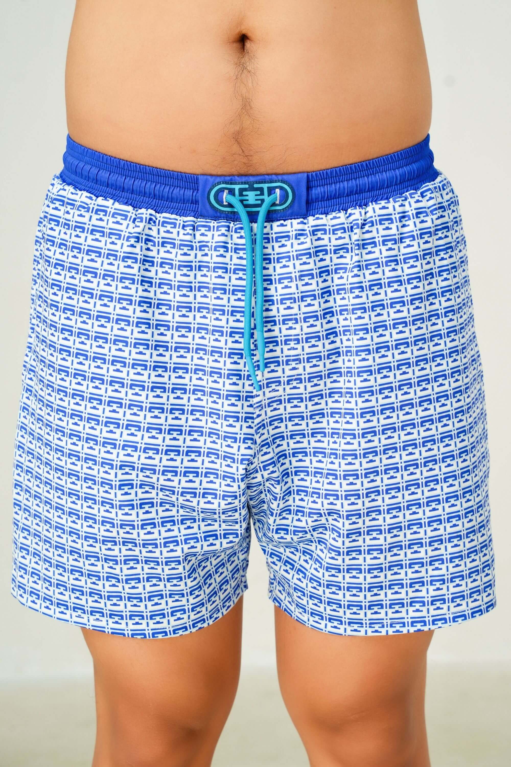 monogram edition swim trunk front view on model #color_pool blue