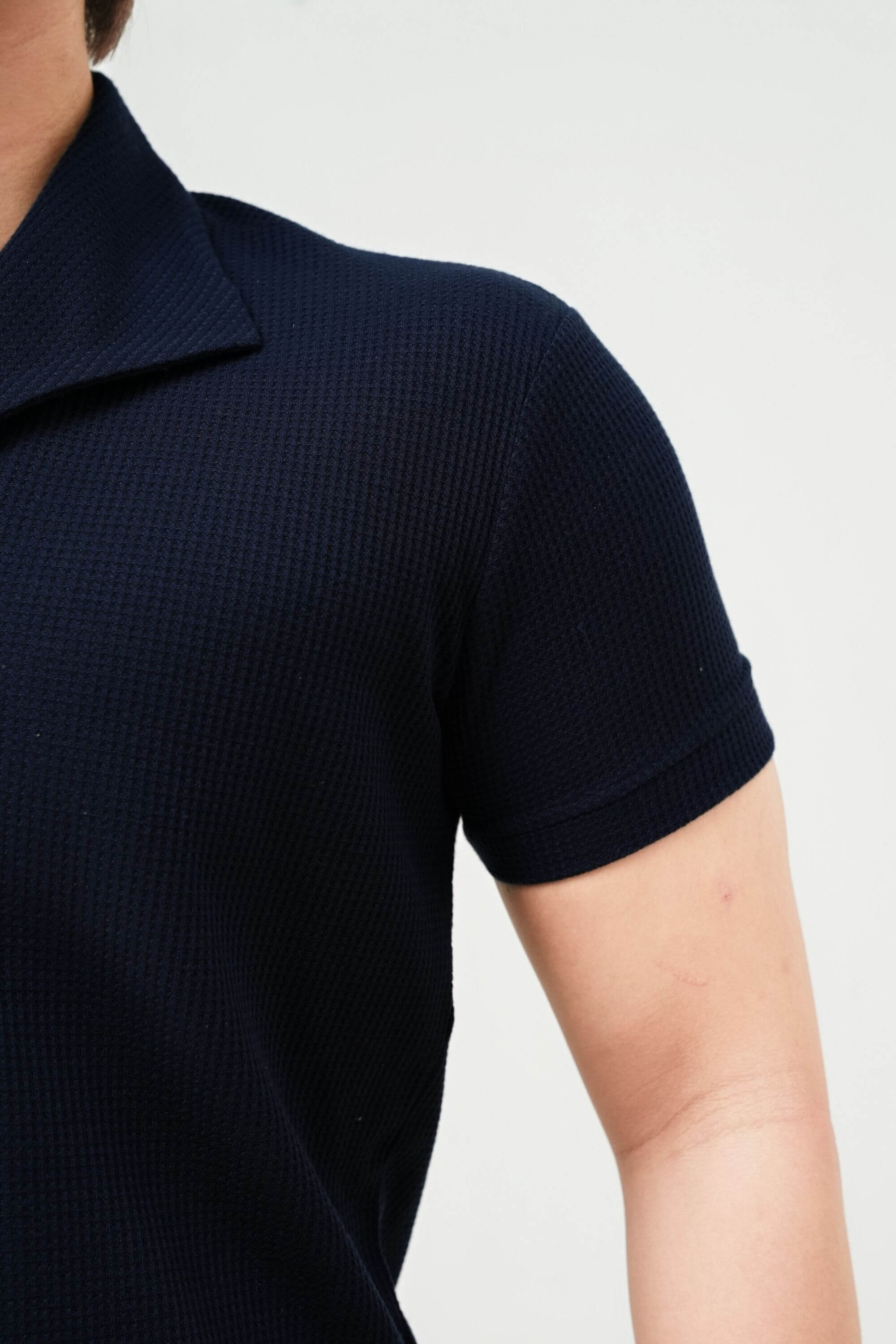 palma polo shirt navy sleeve front view #color_navy